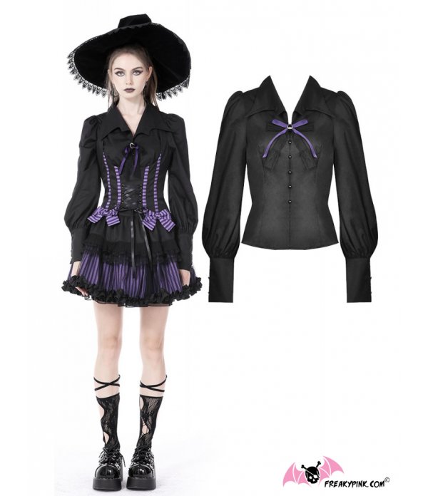 Blouse noire col chauve-souris et broche violette